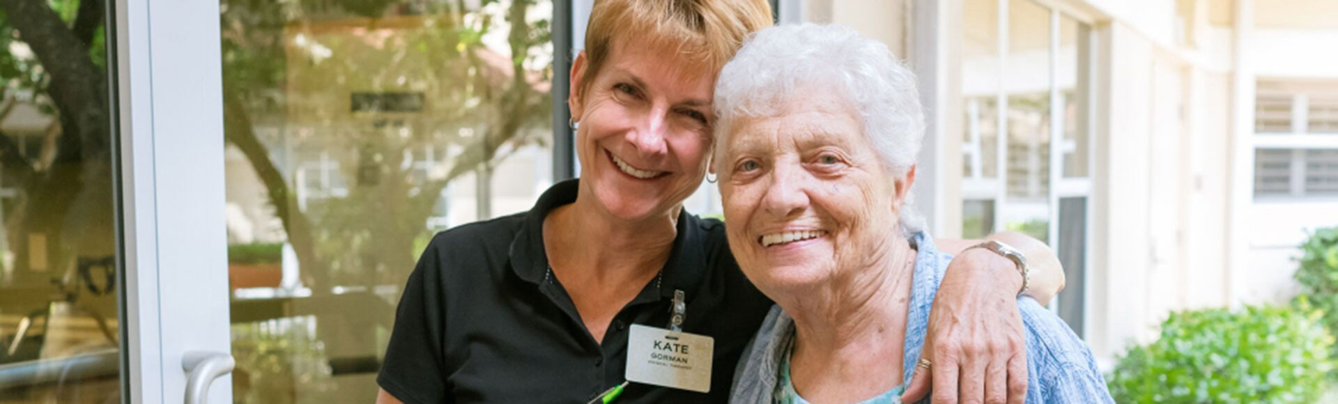 Water's Edge caregiver hugging a resident